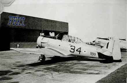 Harvard 3203 in fronts of hangar